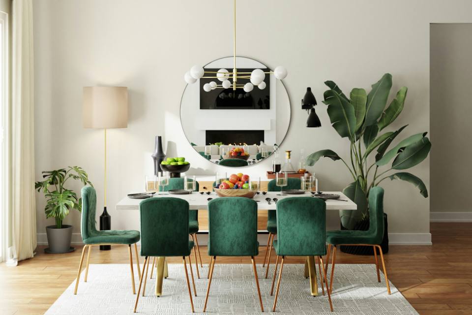 warm wood flooring in dining room with green dining chairs and plants.